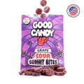 Purple sugar-coated grape gummy candy spilling out of an open Good Candy grape bag, with a Made in USA badge