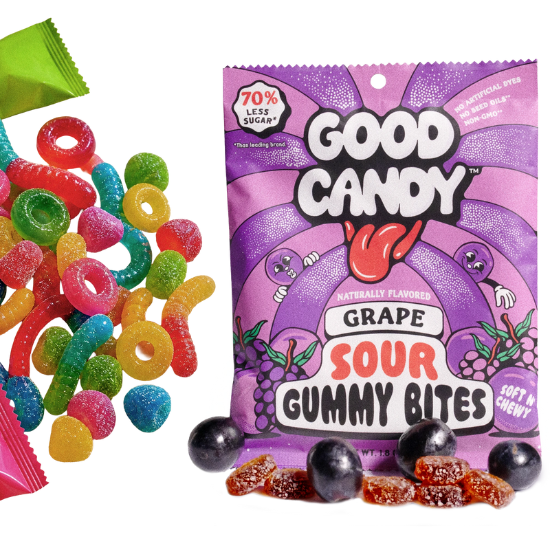 Good Candy grape bag with purple sugar-coated grape gummy candy and whole grapes, beside assorted colorful sour candies
