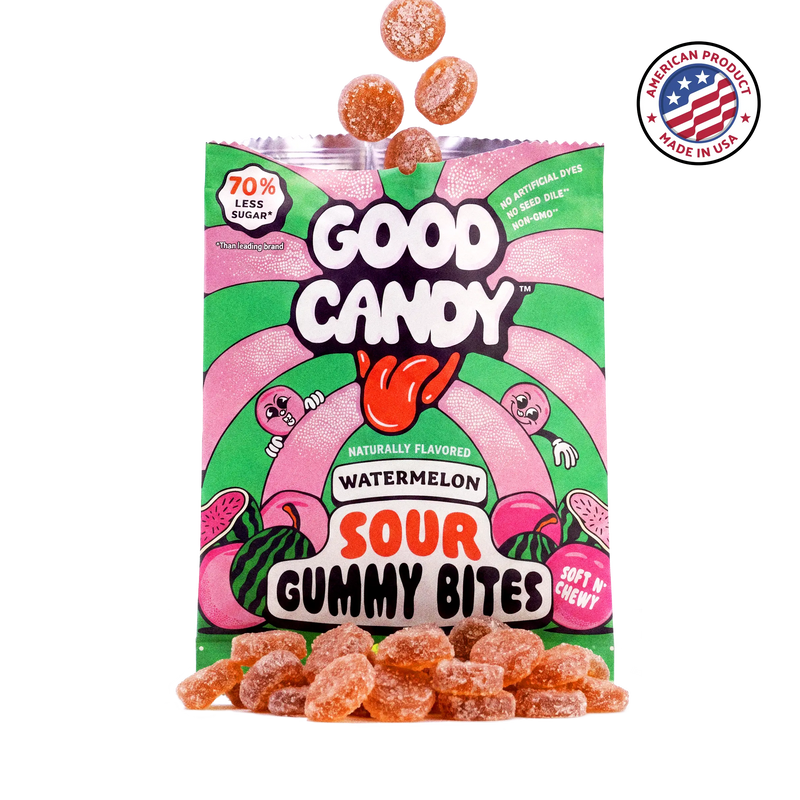 Orange watermelon gummy candy spilling out of an open Good Candy watermelon bag, with a Made in USA badge